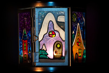A flashlight with stained glass windows (handmade).
