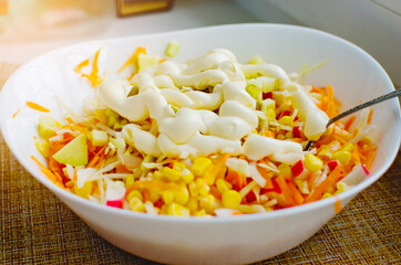 Cooking at home. Vegetable salad with mayonnaise.