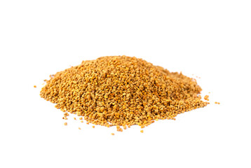 Crumbled bee pollen granules on white background.