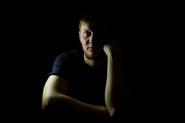 Fototapeta premium The guy on a dark background, the guy with the beard.