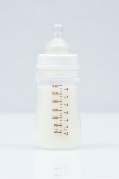 Baby milk bottle on a light background