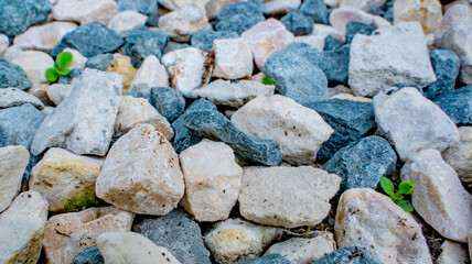 Stone background. blue gravel. Granite texture. The rocky road. Construction material. The texture of the stones. Wallpaper with fine gravel.