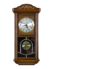 Antique pendulum wall clock isolated on white background