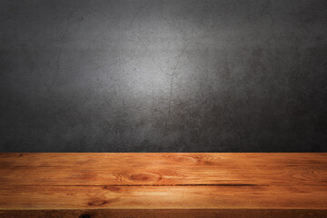 Wooden decking table on a grey grunge background.