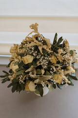 Dried colorful flowers in white flower pot