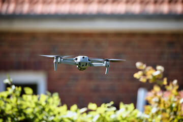 Drone landing in the backyard of a house
