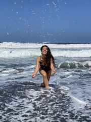 Young woman having fun on the beach