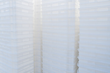 Plastic white boxes. Containers for transportation of food products