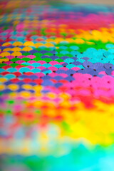 Glitter macro background. Multicolored sparkles. LGBT flag. Fabric paillette