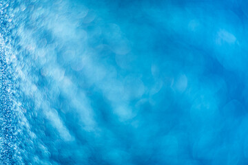 Aqua blue abstract background. Texture bokeh. Defocused image