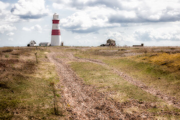 Fototapeta na wymiar The candy coloured Orford Ness lighthouse, Suffolk