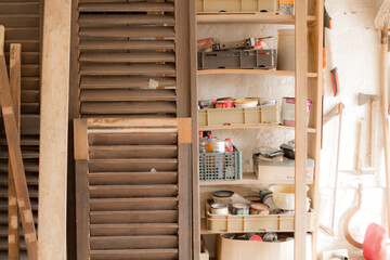 Various carpenter's tools and supplies in a garage.