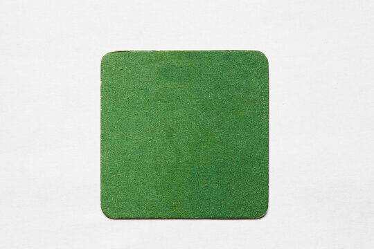 Old used coaster or bottle pad. For beer or other drinks, isolated. Add your own design, message or logo.
