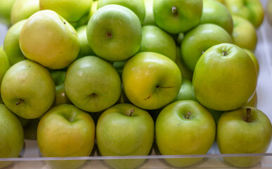 green apples in a market