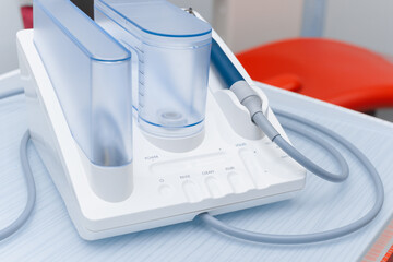 Ultrasonic scaler in the dental office. Dentistry Concept.