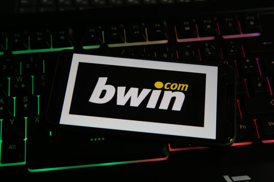 Viersen, Germany - January 9. 2021: Closeup of smartphone screen with logo lettering of online betting provider bwin on computer keyboard