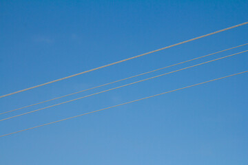 Four thin straight lines on a blue background