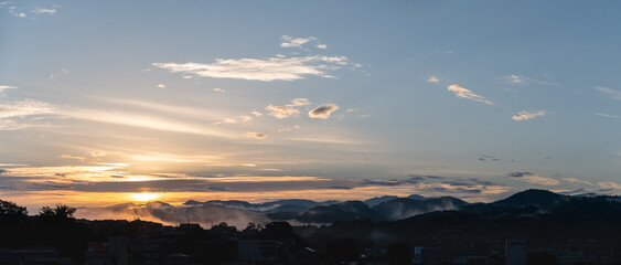 Foggy autumn morning cityscape view over Nabari City during dawn in Mie Prefecture, Japan.