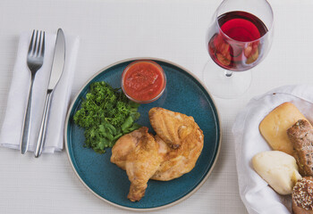 fried chicken with herbs and red sauce