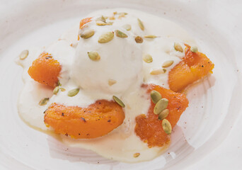 ice cream with caramelized pumpkin and pumpkin seeds