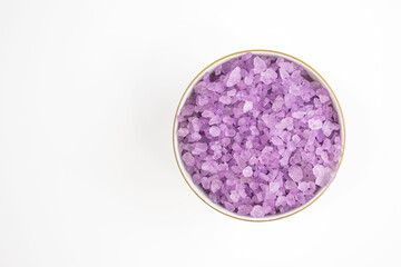 Obraz na płótnie Canvas Lavender salt close-up on white background. Body treatment, skin care concept. Flat lay.