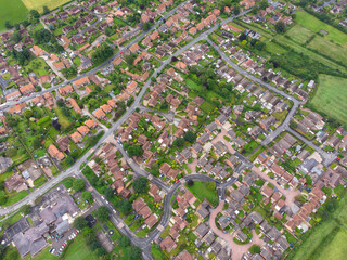 Aerial photo of the UK British town of Wheldrake that is in the City of York in West Yorkshire, showing a typical UK housing estate and rows of houses