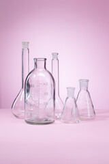 Clean Chemical laboratory glassware on pink background