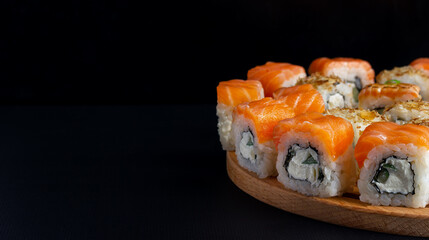 Philadelphia roll with salmon, avocado, cream cheese on black background. Japanese food. Sushi menu. 