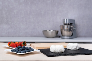 Ingredients for fruit cakes. Berries and meringue. Ingredients for confectionery