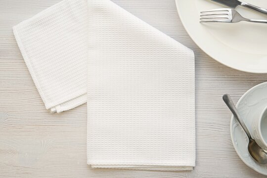 White Clean Kitchen Towel Mockup, Flat Lay With Waffle Kitchen Towel , Plates And Cutlery. 