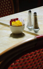 Eco-friendly packaging solutions for restaurants. Sugar bowl with brown and white sugar sachets,...