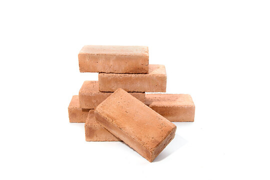 Red bricks isolated on white background. Solid clay bricks used for construction.
