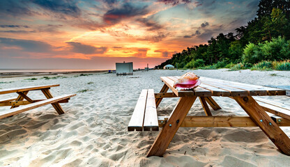 Relaxing point at sandy beach of the Baltic Sea,  Europe. Colorful sunrise, concept of summer vacation and happy resting