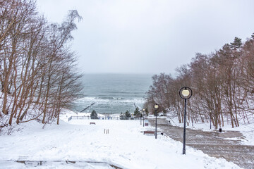 Winter seascape with Baltic Sea waters, horizon and cloudy sky in Kaliningrad region, Russia