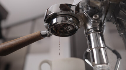low angle shot of espresso pour with naked portafilter