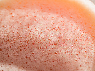 air ball on the juice of an orange and grapefruit, a photo close up macro