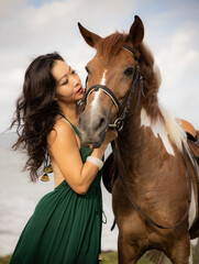 Fototapeta premium Portrait of woman and brown horse. Asian woman hugging horse. Romantic concept. Love to animals. Nature concept. Bali