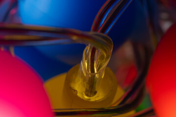 Bunch of colored electric decorative lights and wires macro close up shot