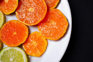 citrus fruit cut on a white plate