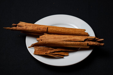 cinnamon stick on white plate