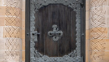 Old wooden door with handle of St. Paul's Church in Basel, Switzerland