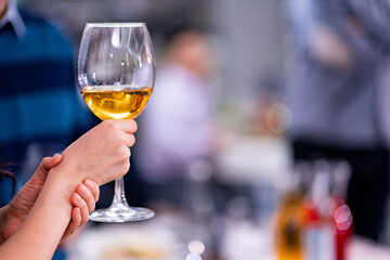 hands with a glass of wine. toast at the party. alcohol consumption. Holiday. Sommelier.