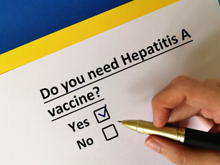 One person is answering question about vaccines. He needs hepatitis A  vaccine.