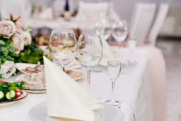 empty wine glasses. serving a table for celebration in a cafe or restaurant. Banquet.