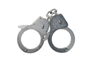 Police handcuffs isolated on white background with light shadows. Pair of real metal handcuffs macro close-up high resolution.