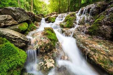 Smooth Cascades in the forest with rocks