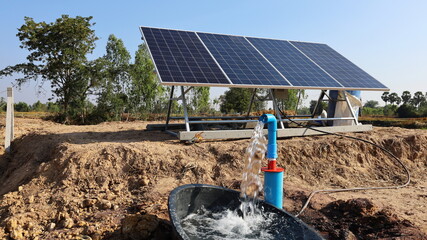 Water pumps and solar panels. Groundwater is pumped with a submersible pump from clean energy or...