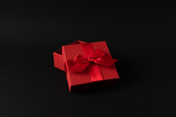 Red gift box on black background