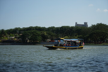 Fototapeta na wymiar Tour boat on shah alam lake garden.