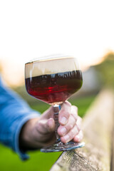 Special Trappist beer glass during a setting sun